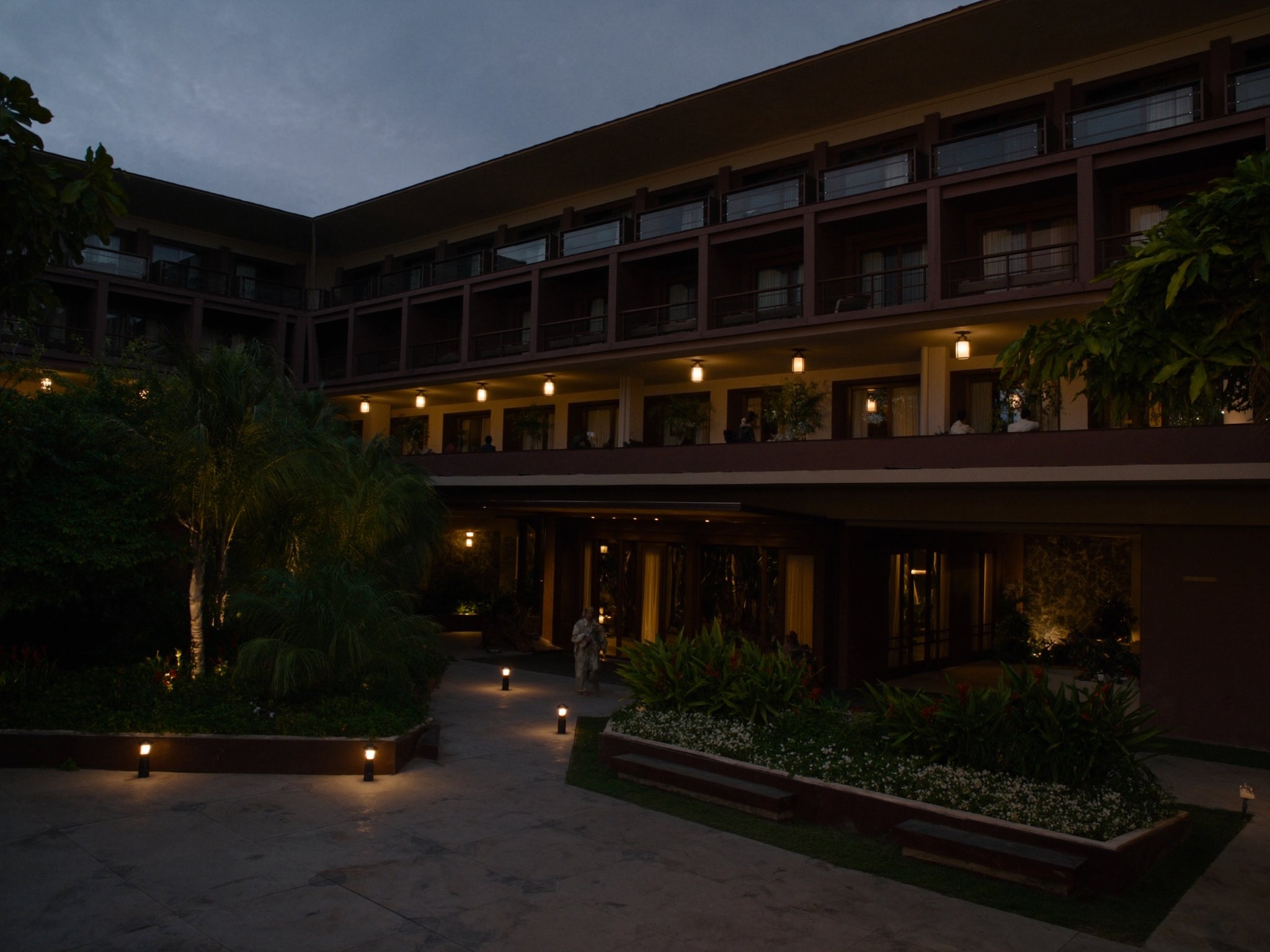 Boutique hotel tropical garden landscaping at dusk